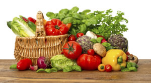 fresh vegetables and herbs on white background