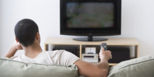 USA, New Jersey, Jersey City, Man watching tv at home